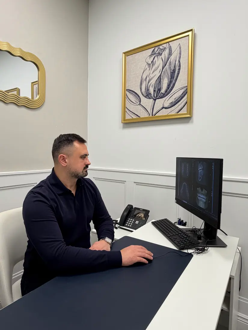 Dr. Slobodian reviewing a 3D scan during surgical planning